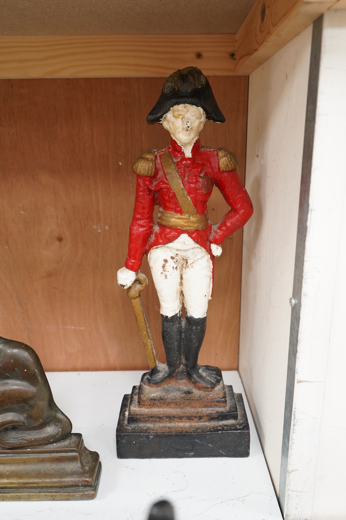 A collection of various metal wares to include door stops, boot scraper, spelter figure etc, largest 49cm high